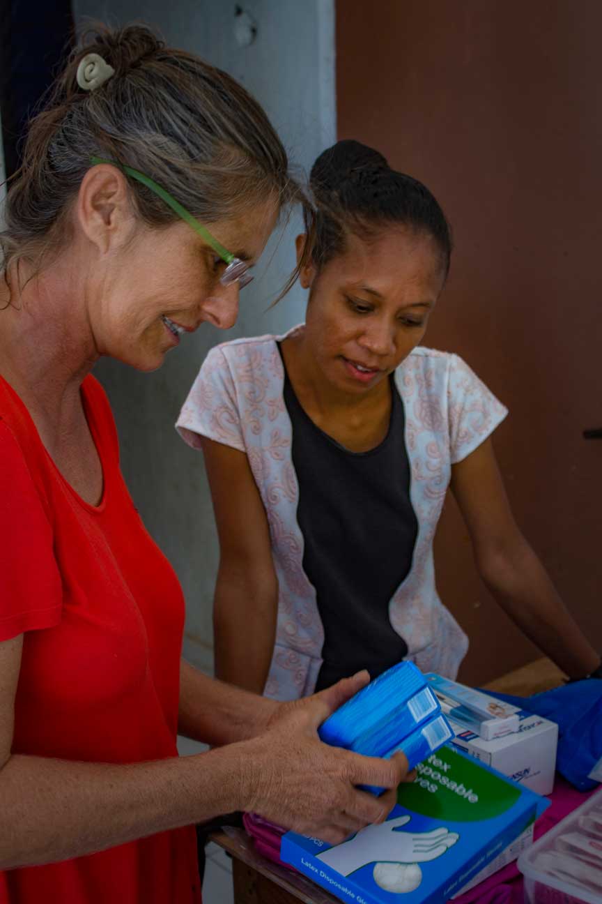 Indira Afonso midwife in Macadade and Vega crew member Meggi Macoun unpack supplies.