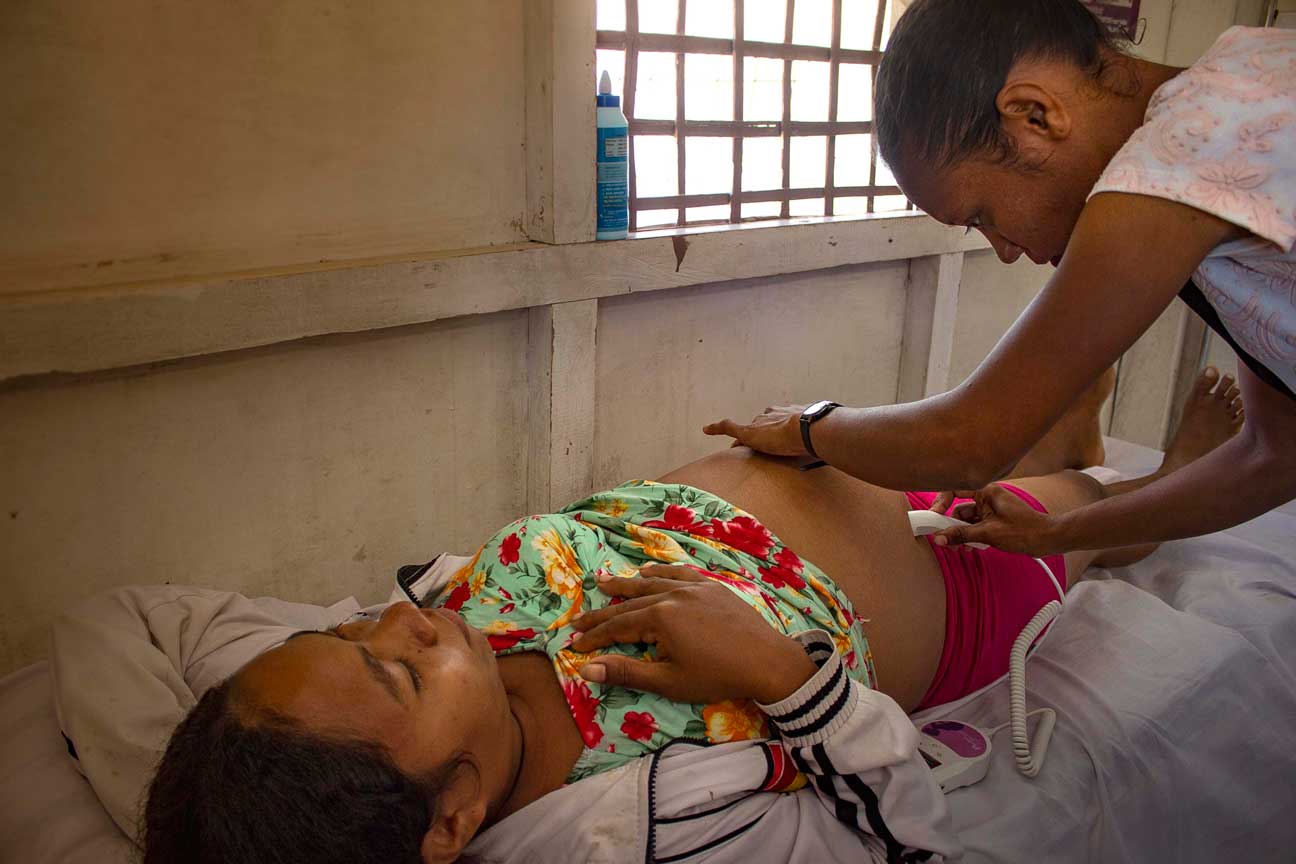 Fetal doppler heart beat monitor in action.