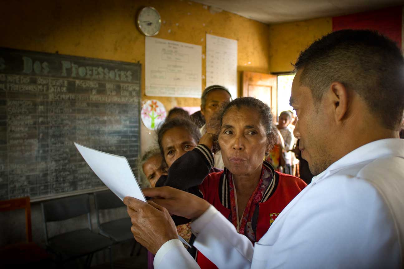 The doctor from the local clinic doing the short-sightedness tests.