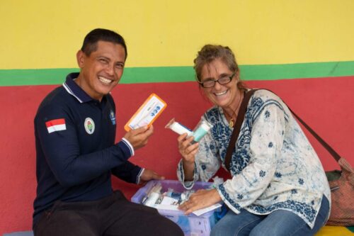 Here Meggi and the district doctor, who services all the surrounding island communities, look through one of the first aid kits. He is giving us a list of other islands along his route and what they need for our next visit.